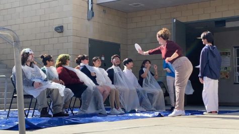 Students and teachers take turns pie-ing each other.