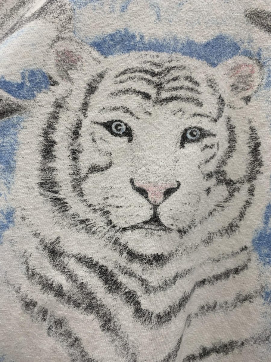 White tigers, known for their white coat, appear in a variety of art and merchandise. 