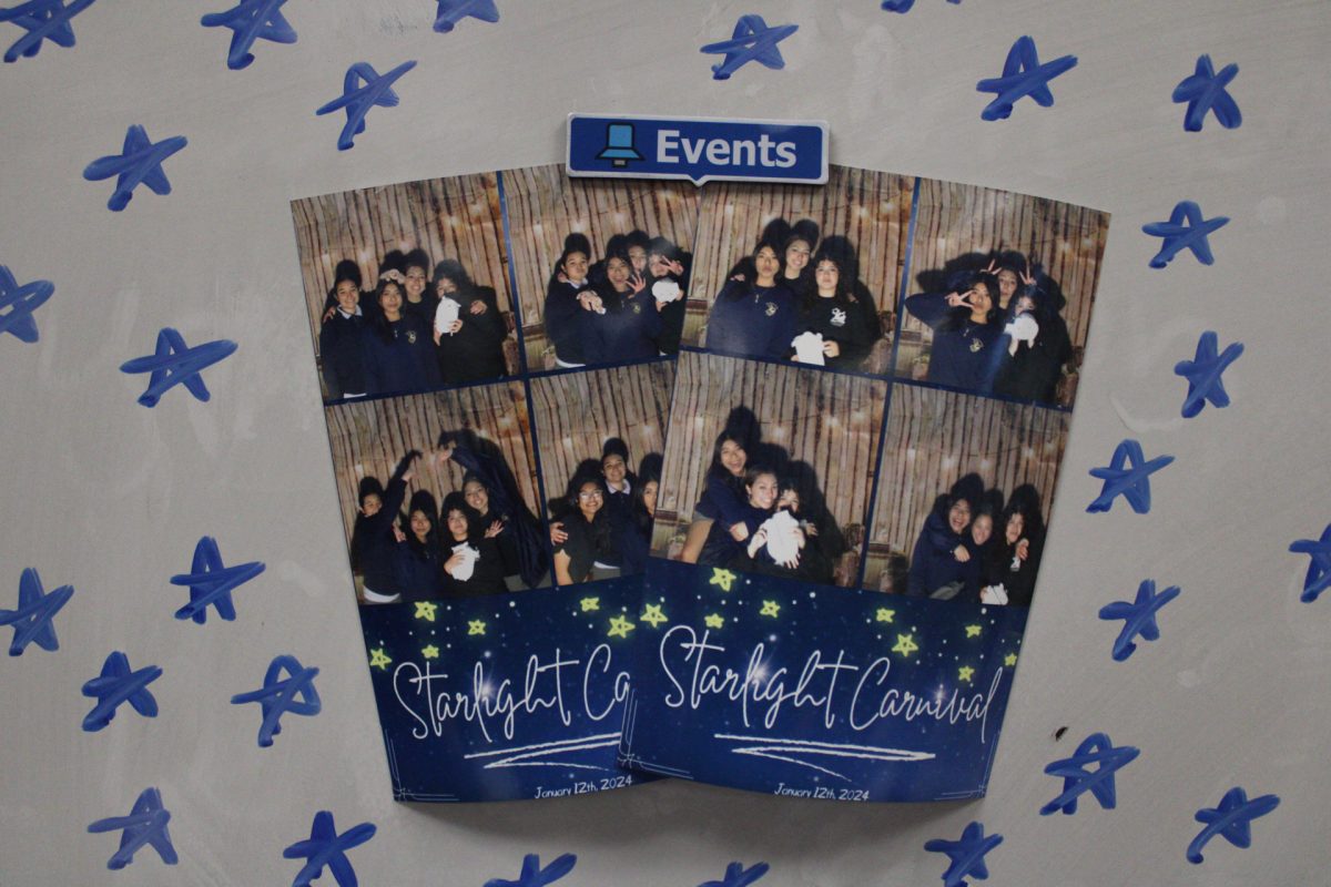 Friend group enjoying the photo booth at the Starlight Carnival.