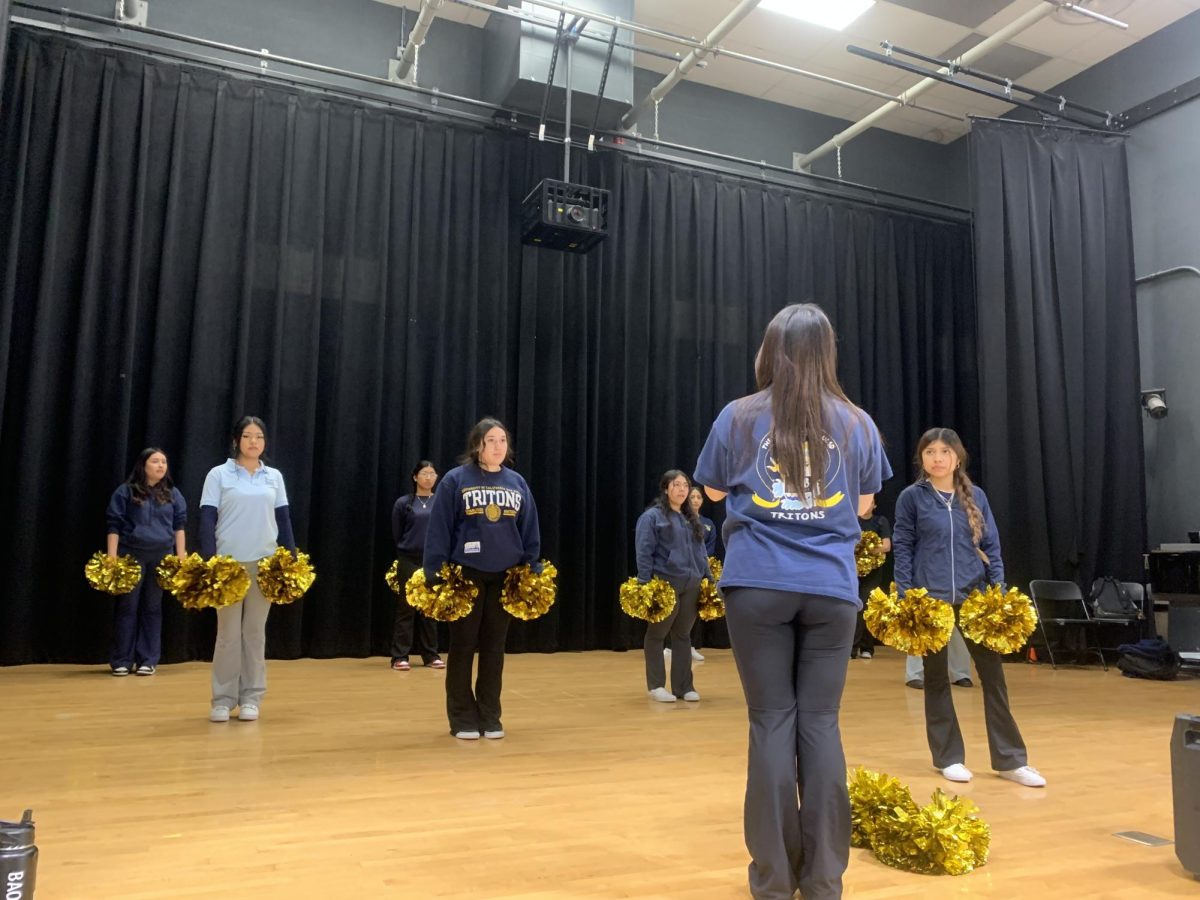 The Preuss cheerleading team practices for Airband.