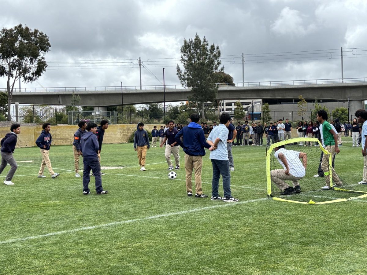 Preuss students playing in a soccer match during lunch. 