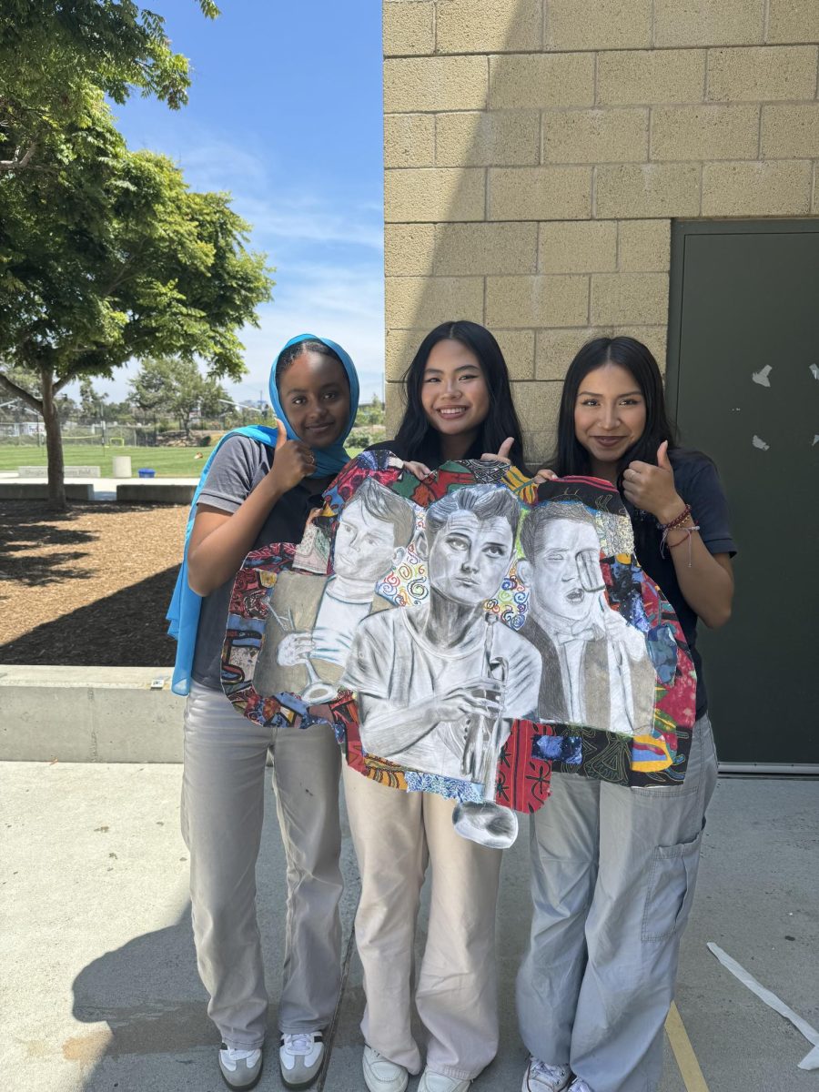 Three art students prepared a drawing for Jazz June.