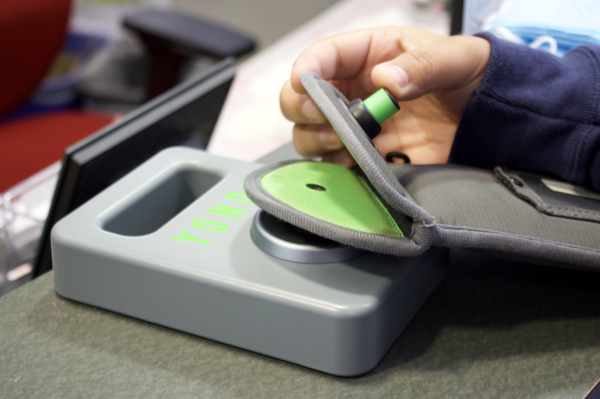 Student unlocking Yondr pouch at the end of the school day. 