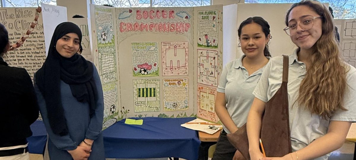 Allison Mendez, Katia Diaz, and Sulaf Abu Duha presenting their work. 
