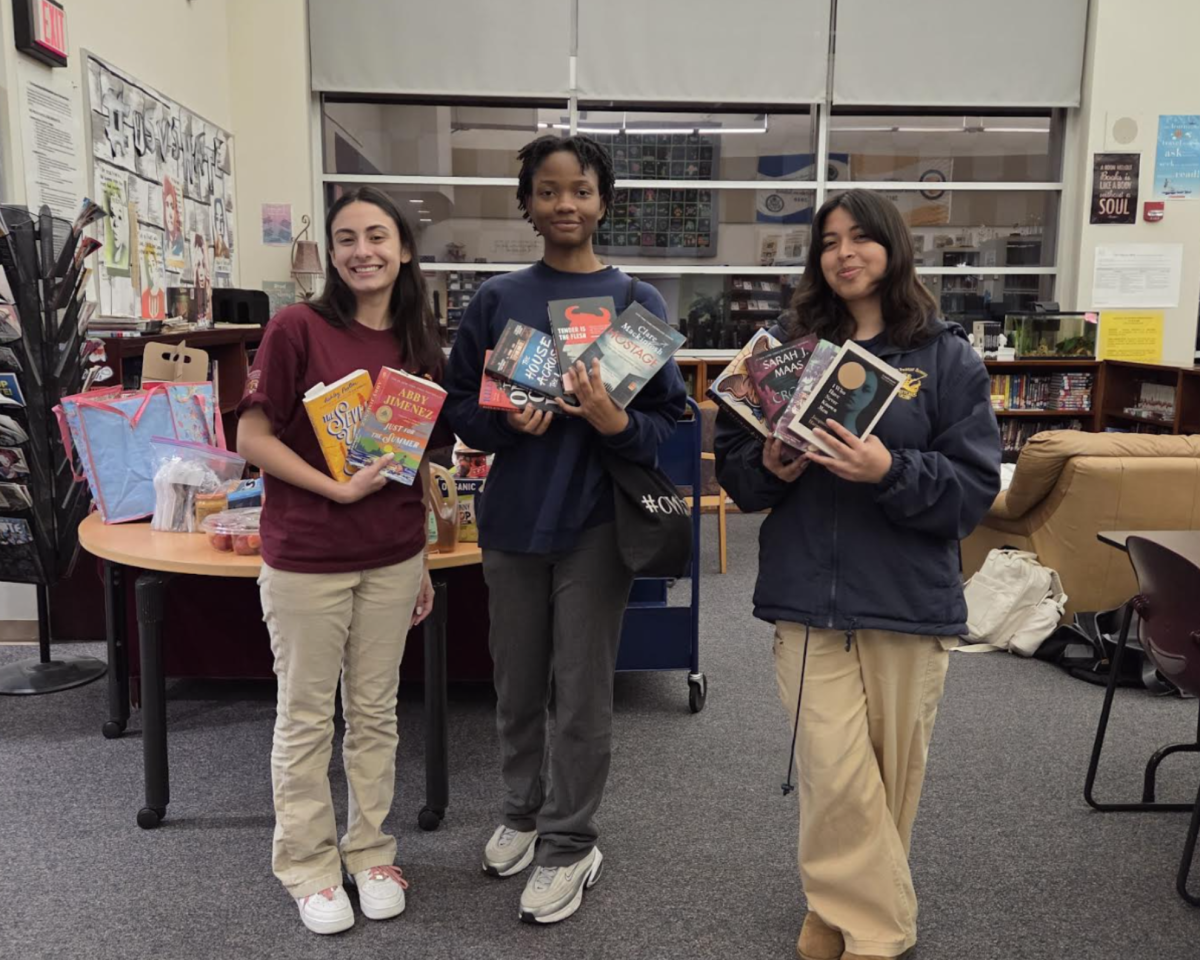 Students showing off their books for the night.