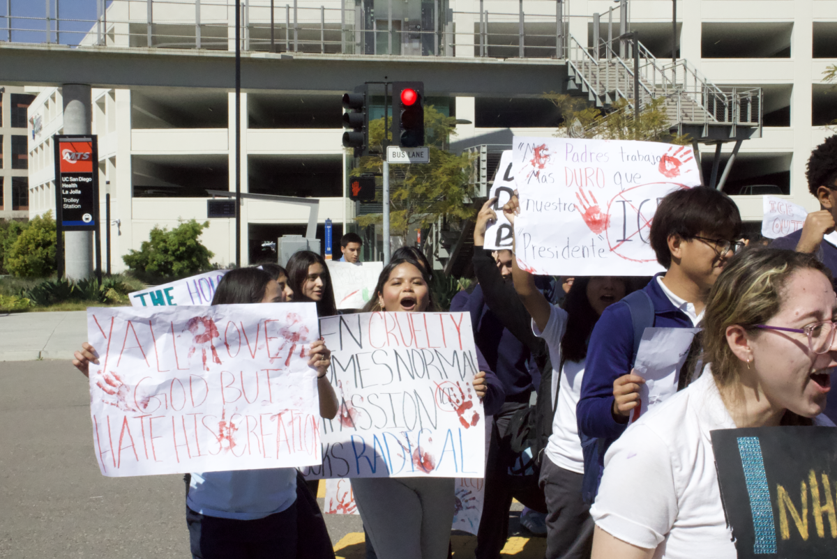 Students protesting on the street on the way to the trolley station. 