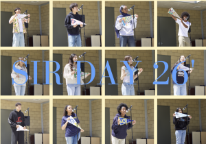 Students displaying their pennants for decision day 2026.