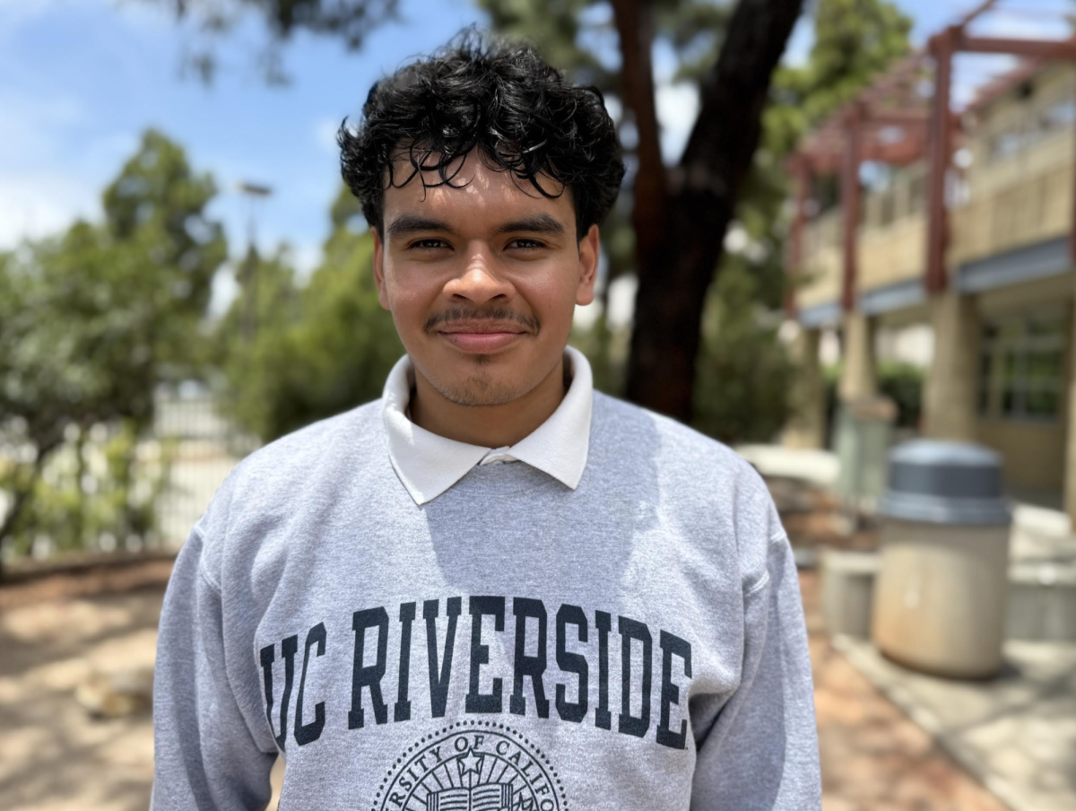 Pedro Lugo-Porres with a UC Riverside hoodie which is the school he is attending in the Fall of 2026